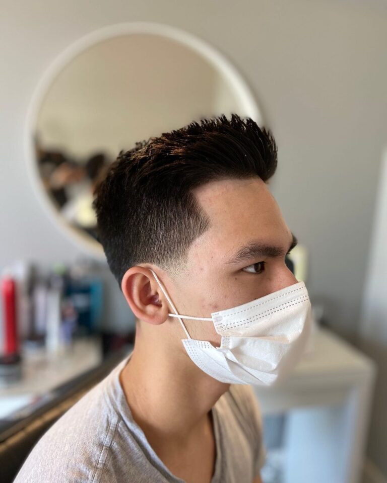 Men's textured crop with tapered sides, client in a face mask, Avalon Salon Calgary